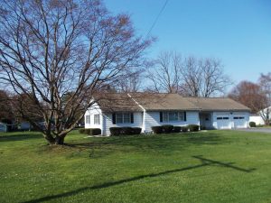 single story white and brown house with lawn sold in blandon pa june 2021 with Wagner Auction Service