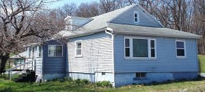 blue home in morhsville pa with multiple additions sold in june 2021 with Wagner Auction Service